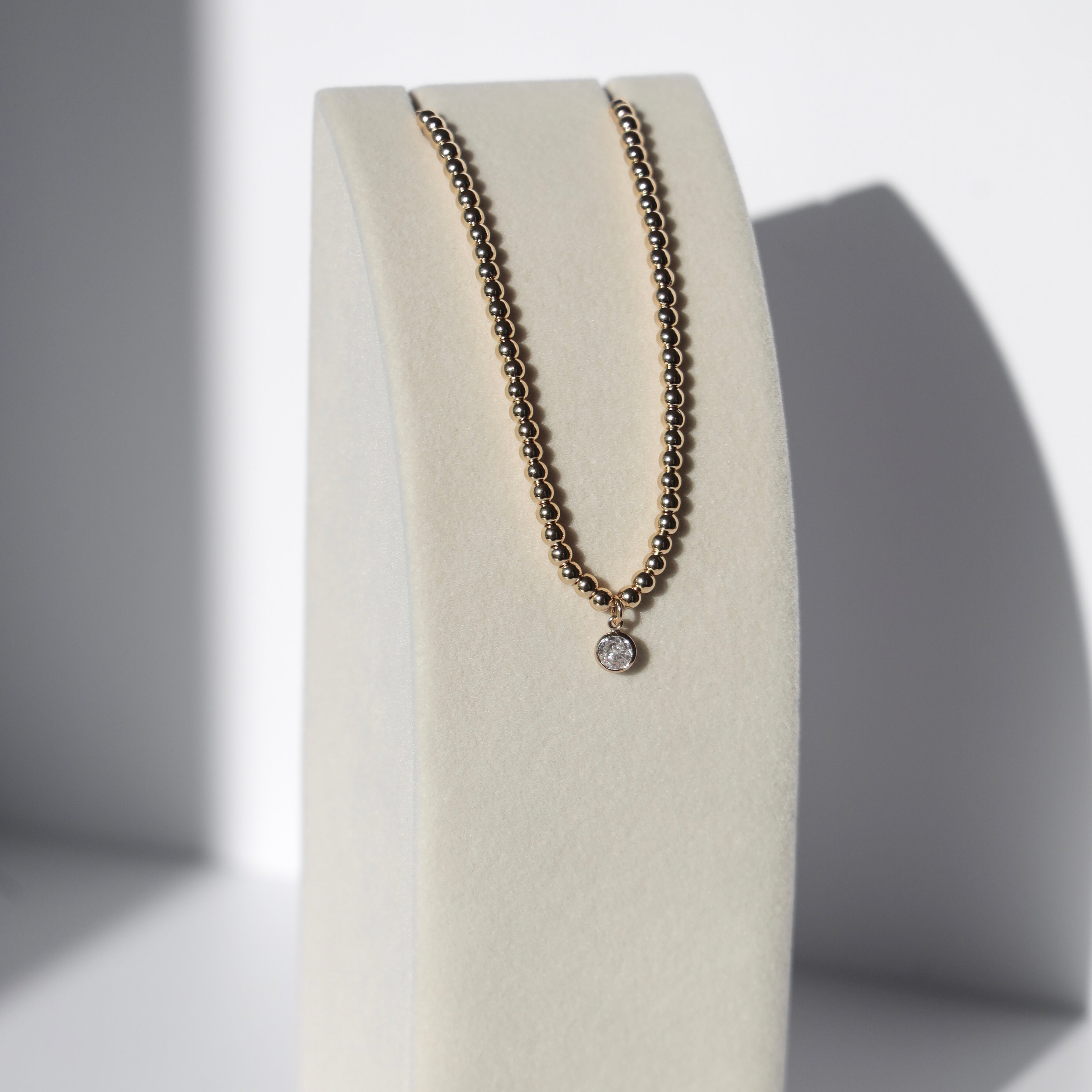 CRYSTAL CIRCLE BEADED NECKLACE