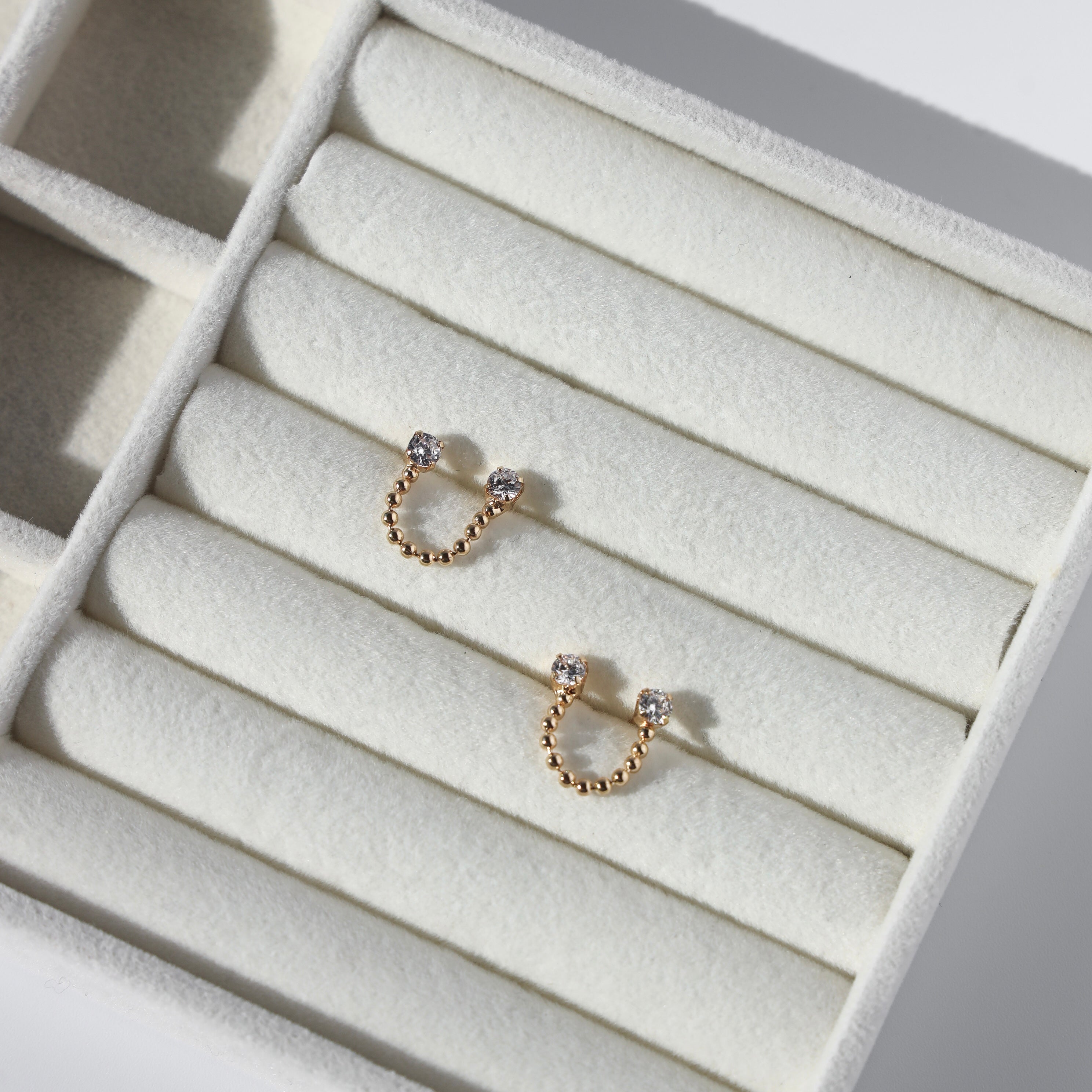 DOUBLE PIERCING DIAMOND STUDS