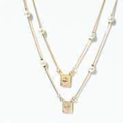 DOUBLE PEARL HAMSA NECKLACE